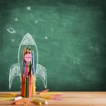 Start School Concept - Rocket Drawn On Blackboard